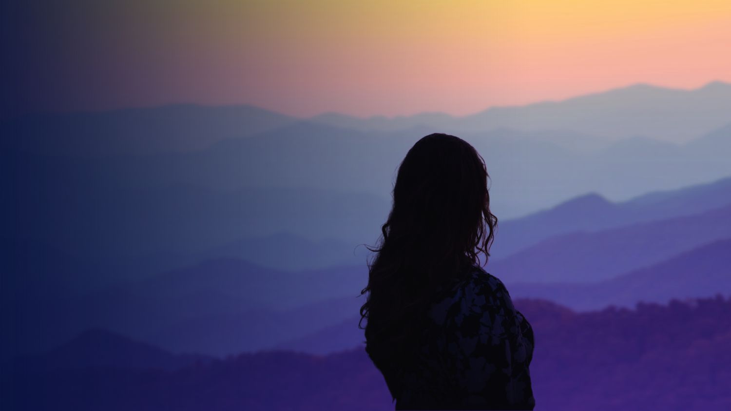 Silhouette of a person sitting alone