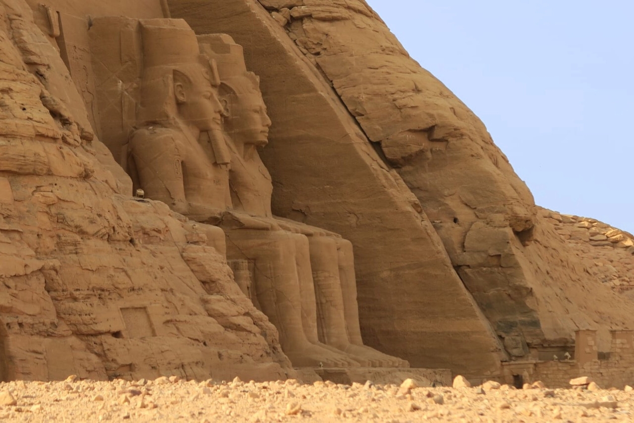 Abu Simbel: Portal to Divine Remembrance The colossal statues of Ramses II at Abu Simbel temple front - Spiritual awakening in Egypt's sacred temples on our Spiritual Tour to Egypt