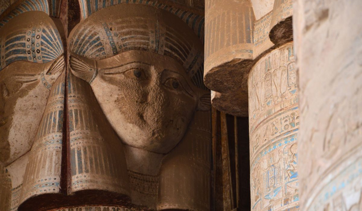 The Temple That Melts Hearts Close-up photograph of Hathor's columns with her distinctive face and "Marlo Thomas-like hairdo, Spiritual Tour to Egypt