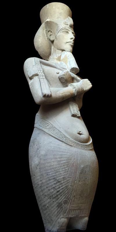 The Forgotten Light of Akhenaten: Discovering Egypt’s Spiritual Legacy 13 foot Pharaoh Akhenaten statue on a black background in the Cairo Museum