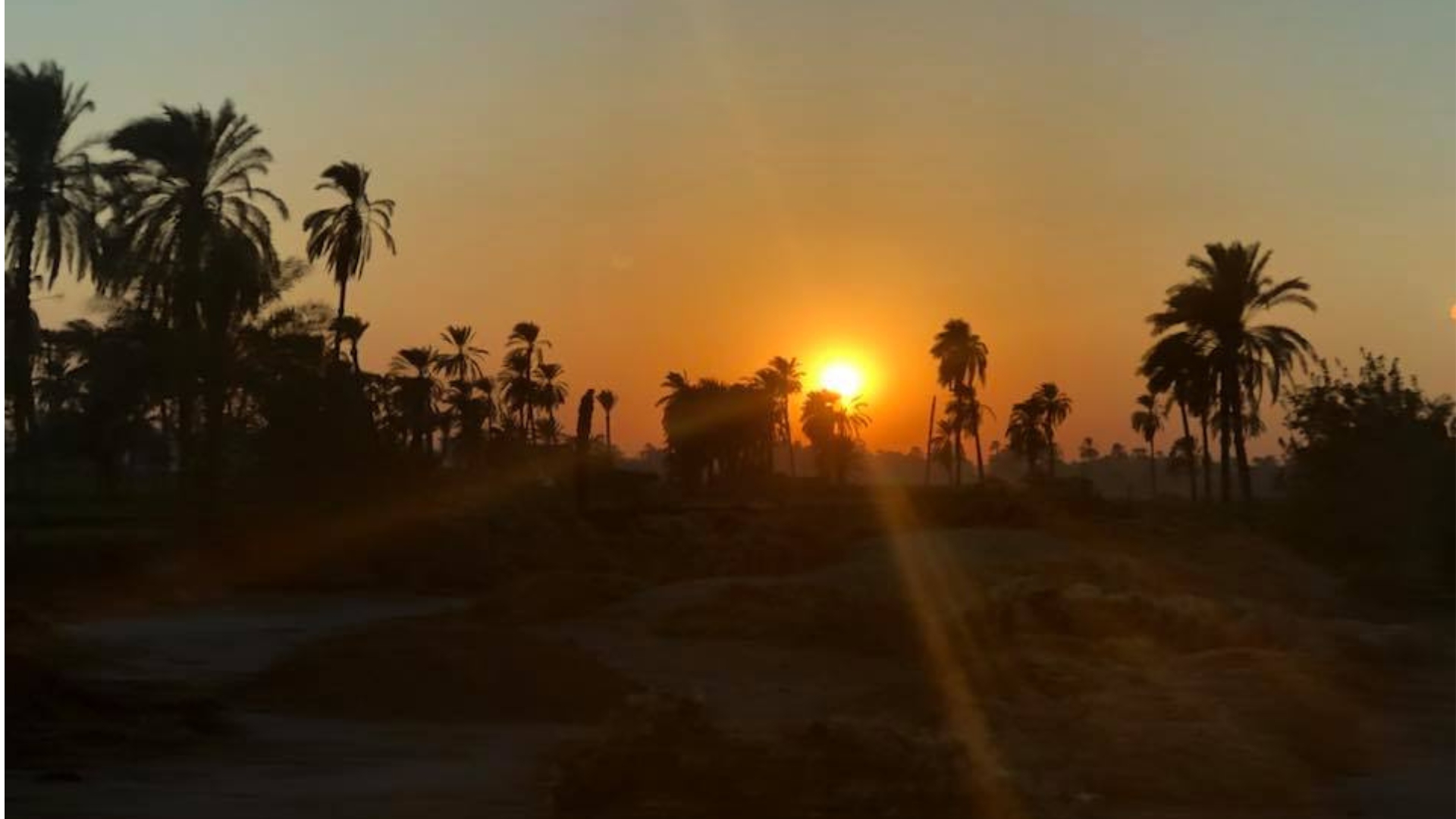 path-of-zep-tepi-amarna-egypt-sunset Aten (the sun) shining bright in the sky at the sunset in Amarna, Egypt