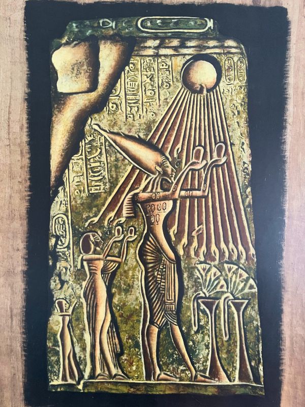 The Revolutionary Pharaoh Ancient Egyptian papyrus showing Akhenaten and his family worshipping the Aten, with sun rays ending in hands reaching down toward them