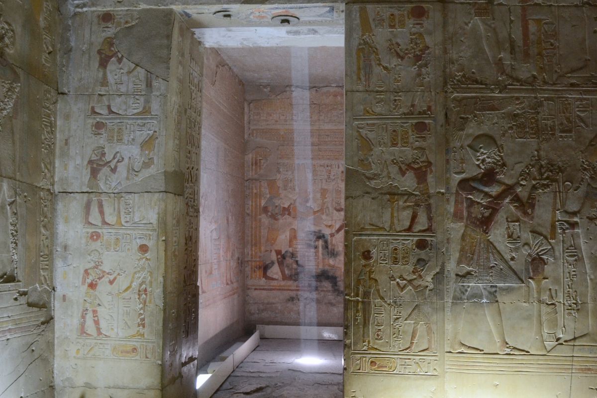 A Sacred Journey to Ancient Divinity Sanctuary in the sacred site of Abydos temple, Egypt, show elegant bas relief of Osiris and other Egyptian Gods