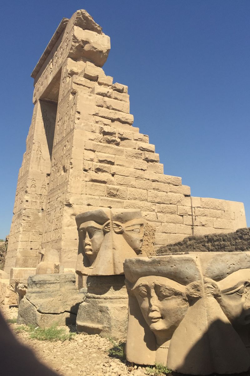 Ancient Hathor capitals outside the Temple of Hathor at Dendera, Egypt