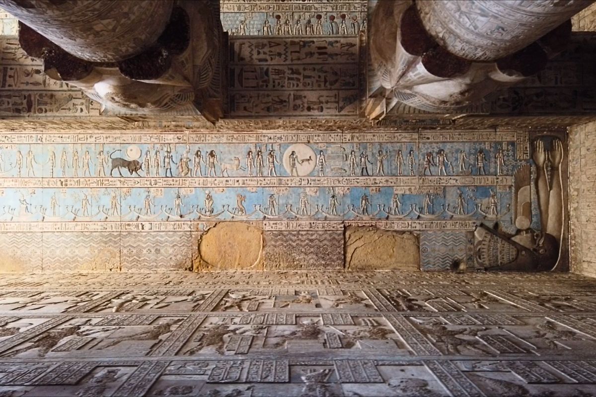 Colourful relief and painted wall carvings inside the Temple of Hathor at Dendera, Egypt
