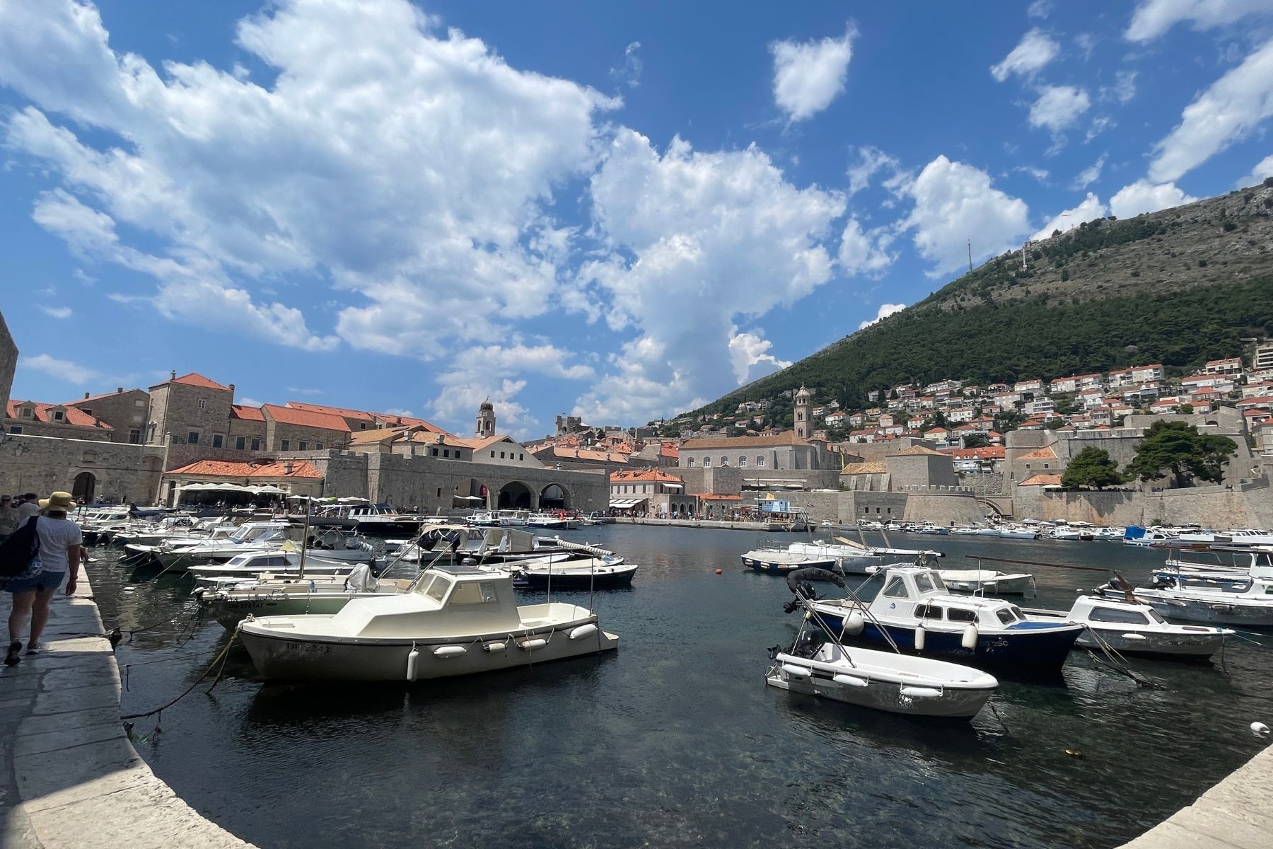 Boats in Dubrovnik Old Harbour overlooking the Adriatic Sea during a Bosnia and Croatia spiritual pilgrimage.